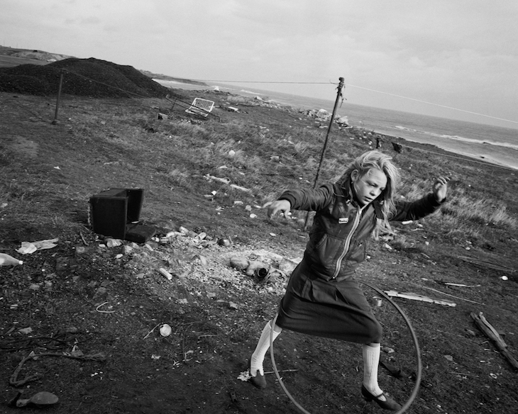 Helen and Her Hula-hoop, Lynemouth, Northumberland (1984; negative); (1985; print), Chris Killip. J. Paul Getty Museum, Los Angeles. Courtesy the artist.