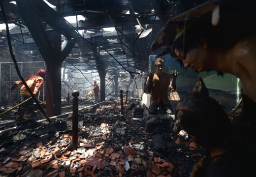 Indonesian firefighters working to extinguish a fire inside the 17th-century Dutch colonial building maritime museum in Jakarta on 16 January 2018.