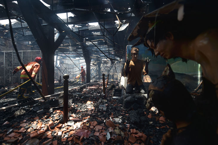 Indonesian firefighters working to extinguish a fire inside the 17th-century Dutch colonial building maritime museum in Jakarta on 16 January 2018.