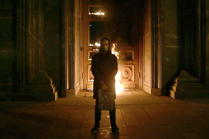 Russian artist Pyotr Pavlensky poses after setting fire to the doors of the headquarters of the FSB security service, the successor to the KGB, in central Moscow early on November 9, 2015. Photo by NIGINA BEROEVA/AFP via Getty Images