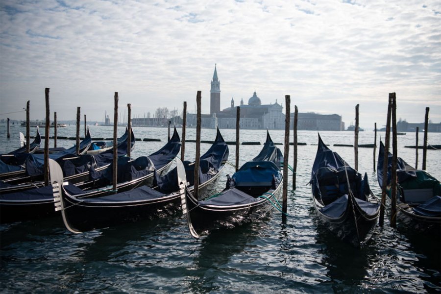 In hibernation: covered gondolas line the shore in Venice in December 2020.