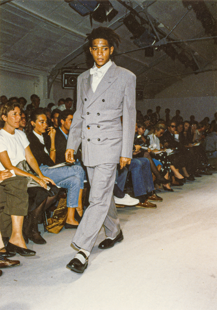 Jean-Michel Basquiat modelling at a Comme des Garçons show.